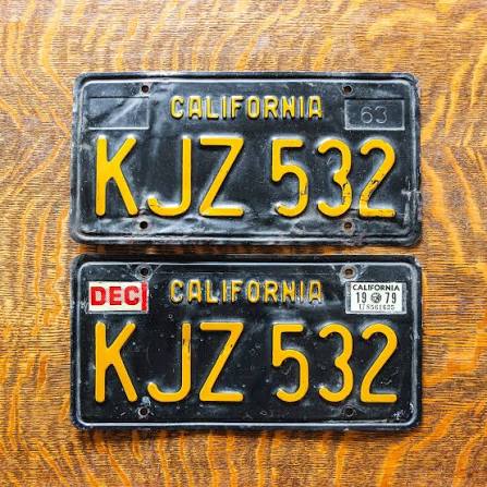 1963 California black license plate with yellow characters, the classic black-plate design used through 1969