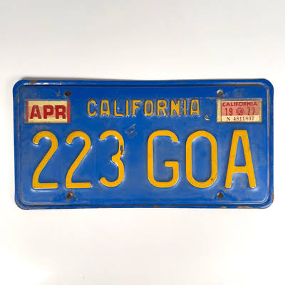 1970s California blue license plate with yellow characters and CALIFORNIA across the top