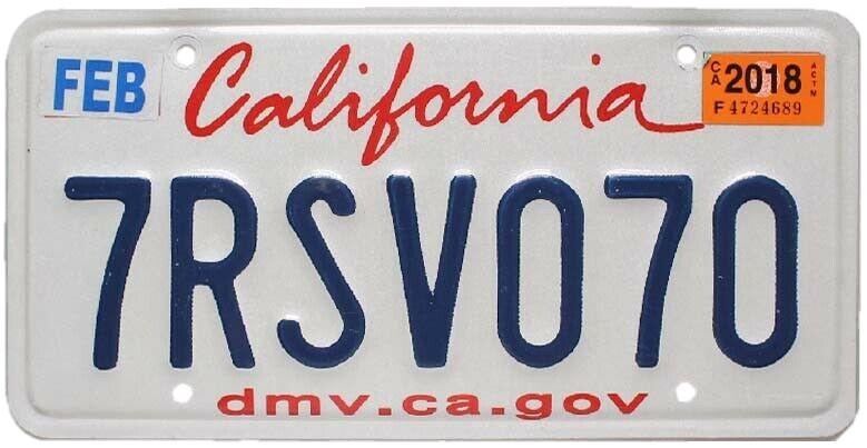Current California standard license plate: white background, dark blue serial characters and red scripted California wordmark