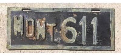 Early Montana license plate with a simple numbered design from the first state-issued plate era