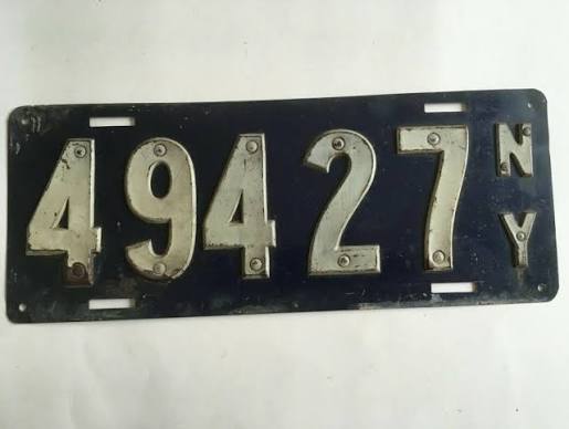 1910 New York state-issued license plate, dark blue with riveted white numbers