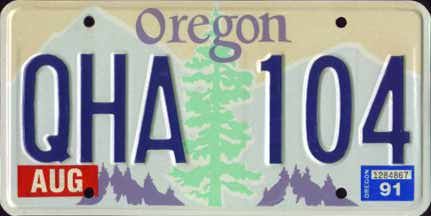 Original 1988 Oregon Douglas fir graphic license plate with mountain backdrop