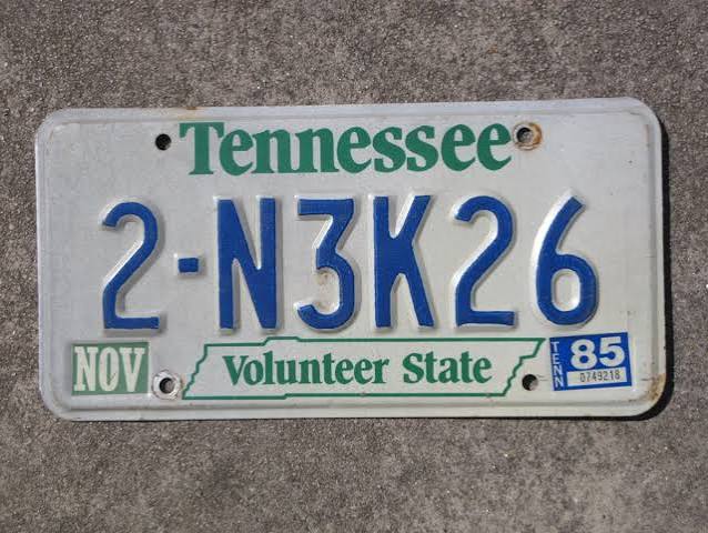 Mid-1980s Tennessee license plate with the state name screened in green